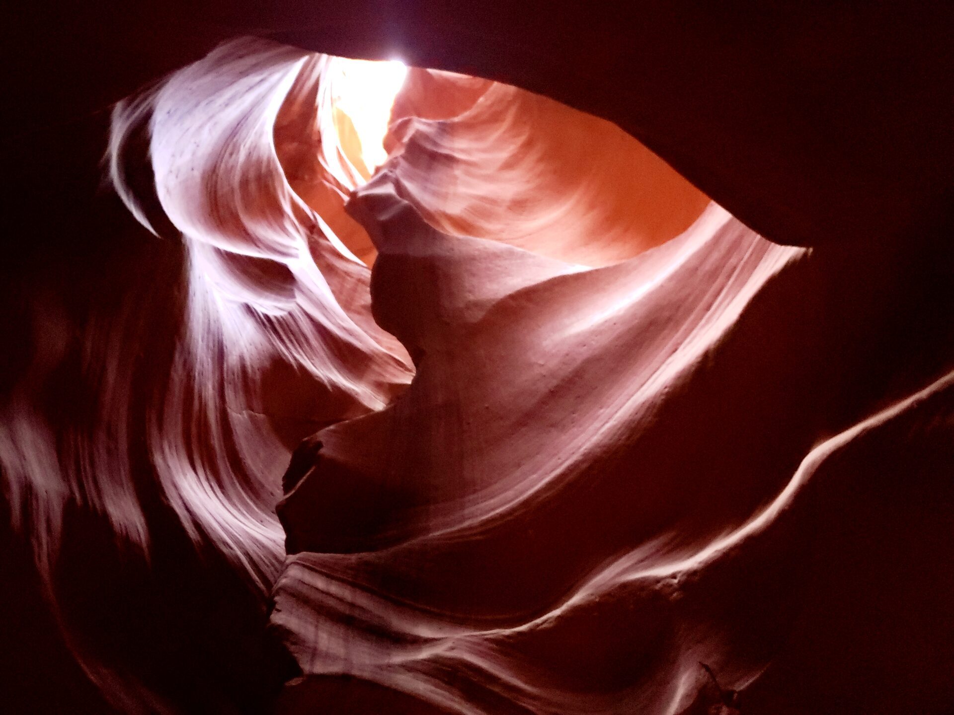 Wide glowing sandstone canyon curve, lit from above, Antelope Canyon, Arizona — the geode opened along its natural seam